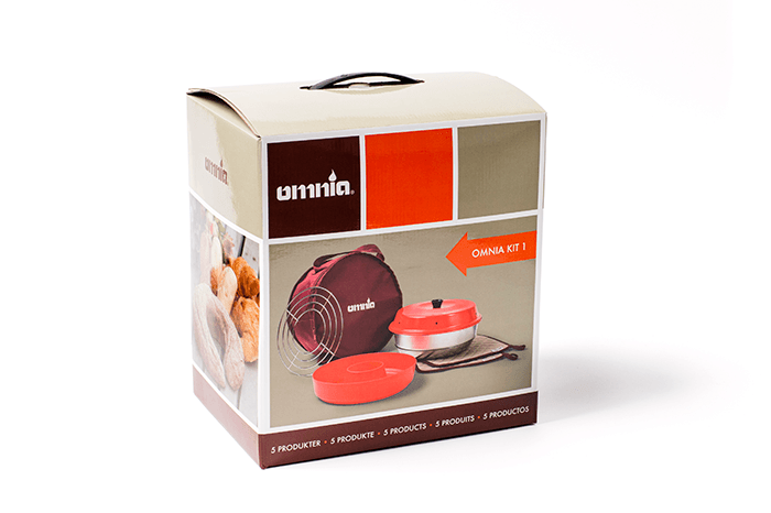 Win an Omnia Kit 1 Retail packaging of the Omnia Kit 1 showing the portable stovetop oven, red storage bag, and accessories designed for cooking while traveling or camping