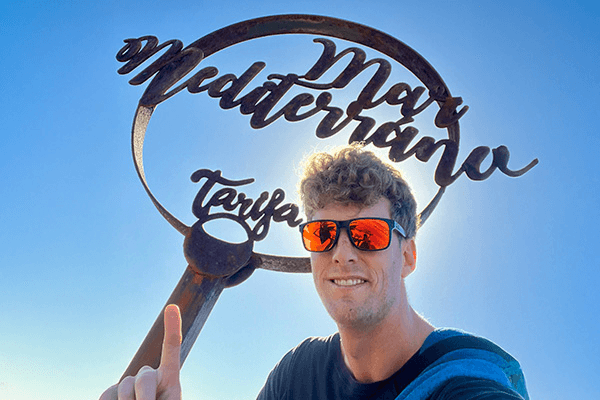 Made it to Tarifa - @van4life__ 04/2025 Chris from @van4life__ stands in front of the “Mar Mediterráneo Tarifa” sign in Tarifa, Spain, marking the meeting point of the Mediterranean and Atlantic.