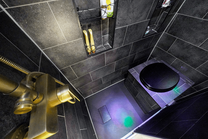 Our modern bathroom in our van - @gary_and_sheila 06/2023 Compact bathroom inside a self converted Fiat Ducato camper van featuring a tiled shower, modern fixtures, floor drain, and a dry separation toilet. The image highlights a high end DIY van conversion bathroom, full time vanlife comfort, and smart space use from the long term overland journey of @gary_and_sheila.